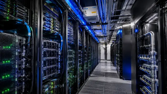 High-density AI server racks with overhead busway and liquid cooling infrastructure in Kansas City data center